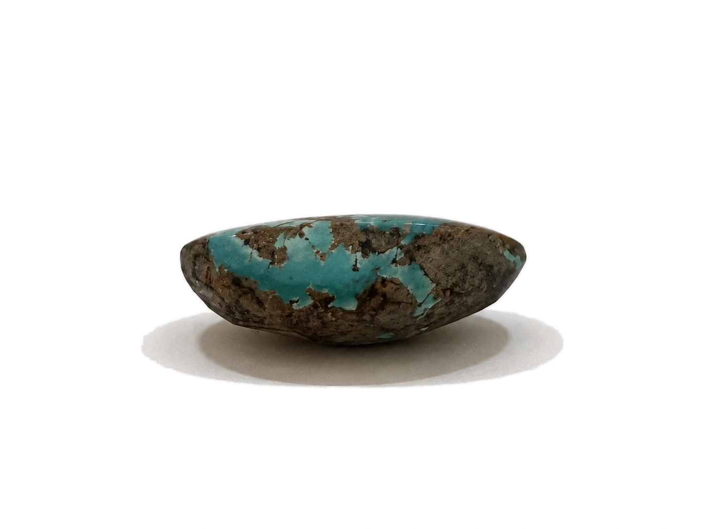 NEYFI 1003 Neyshabur turquoise low-dome oval cabochon, side view A
