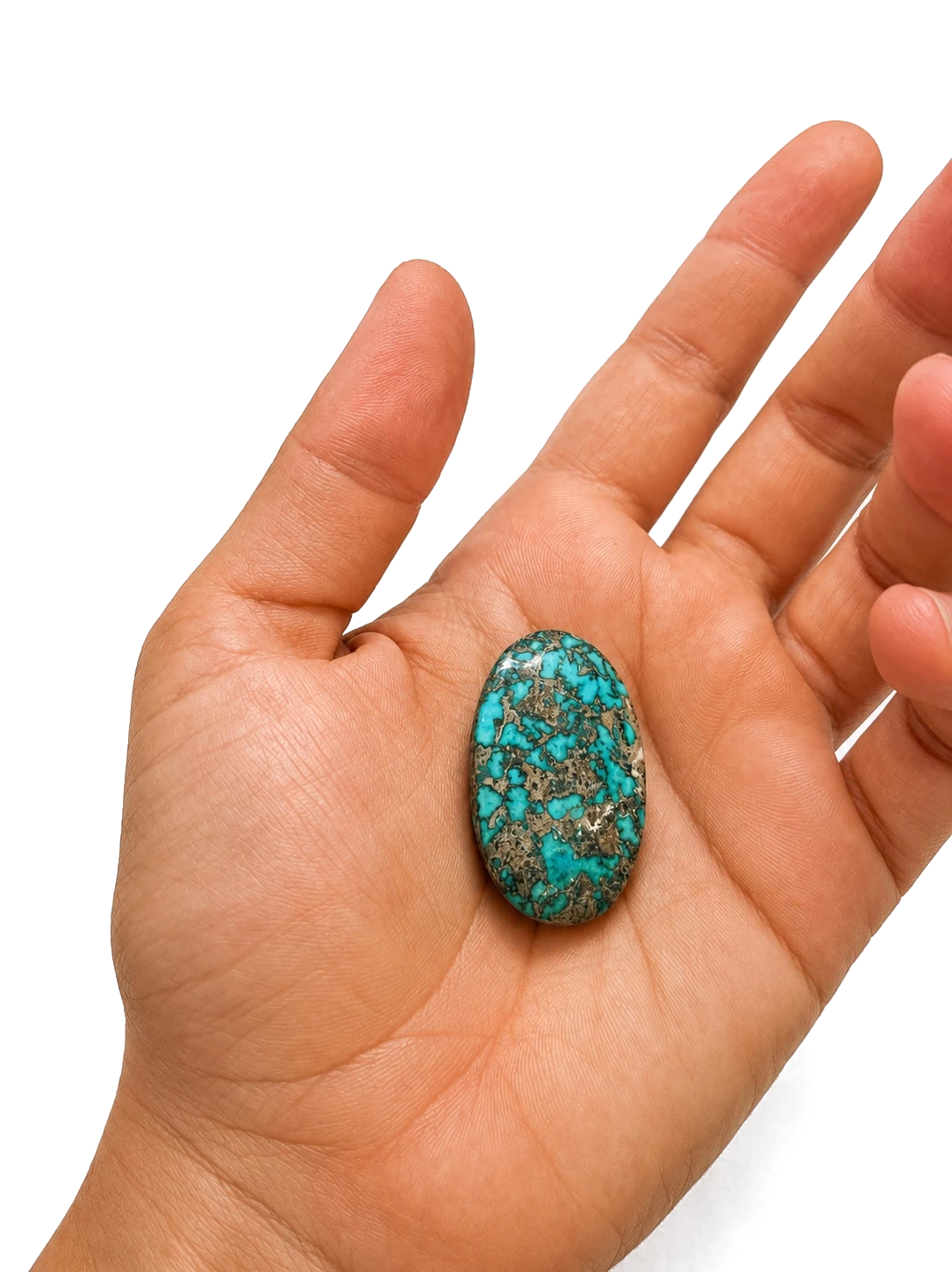 NEYFI 1004 natural Neyshabur turquoise elongated oval cabochon held in hand for scale