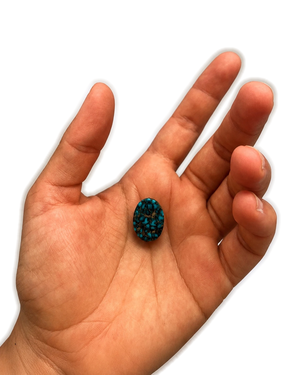 NEYFI 1009 natural Neyshabur turquoise held in hand for scale