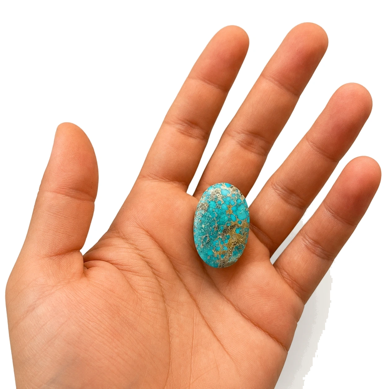NEYFI 1012 natural Neyshabur turquoise held in hand for scale
